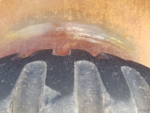 Driver rear wheel rub.